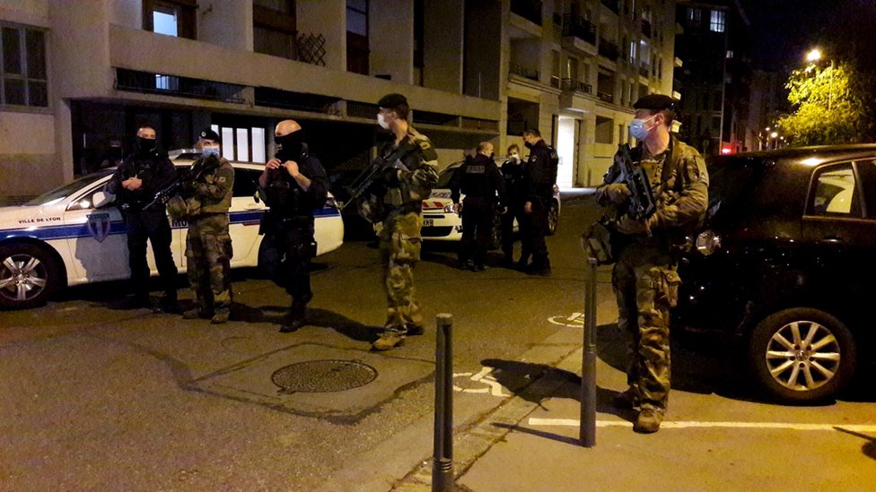 Police secure a street after a Greek Orthodox priest was shot and injured at a church in the centre of Lyon, France October 31, 2020.