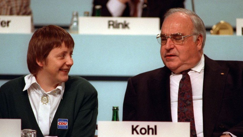 Angela Merkel and Helmut Kohl, at a CDU meeting in 2001.