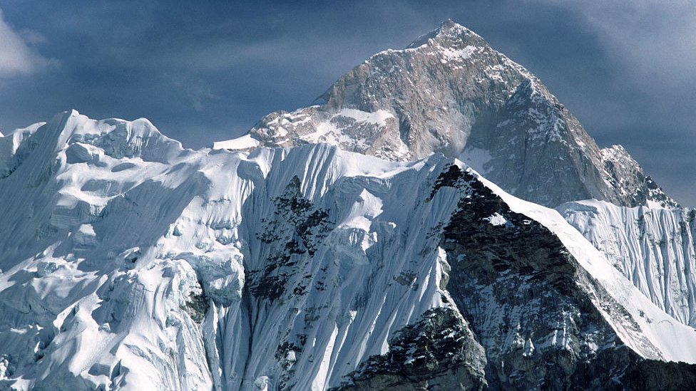 Mt Everest stands behind Mt Nuptse as seen from the Nepal side