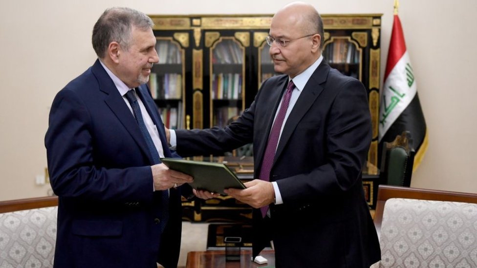 الرئيس العراقي برهم صالح ورئيس الوزراء المكلف توفيق علاوي