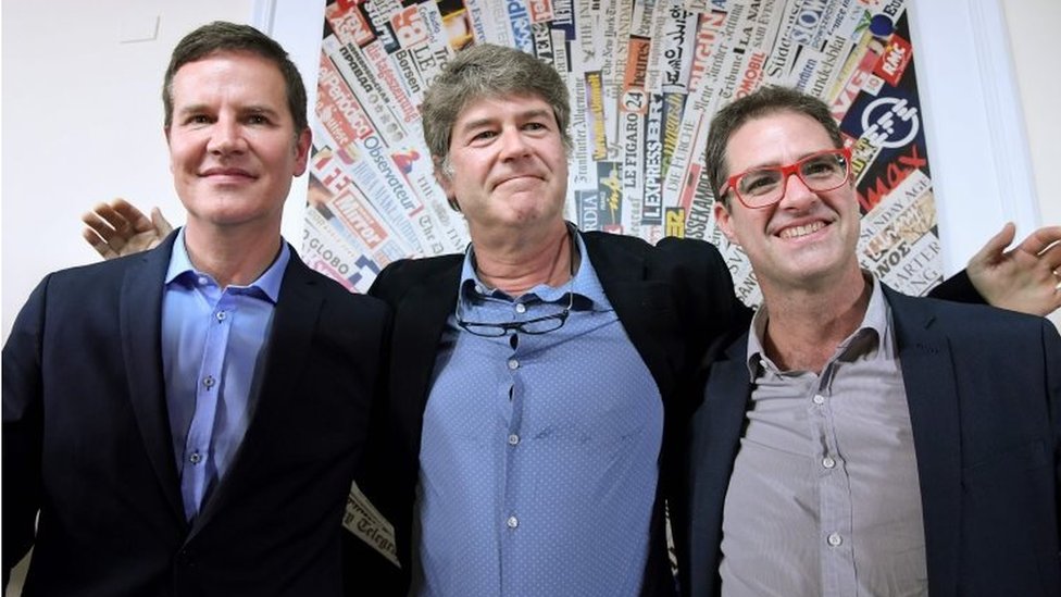 In this file photo taken on May 02, 2018 Chilean sexual abuse victims Jose Andres Murillo (R), James Hamilton (C) and Juan Carlos Cruz (L) pose at the end of a press conference at the Foreign Press Association in Rome on May 2, 2018.