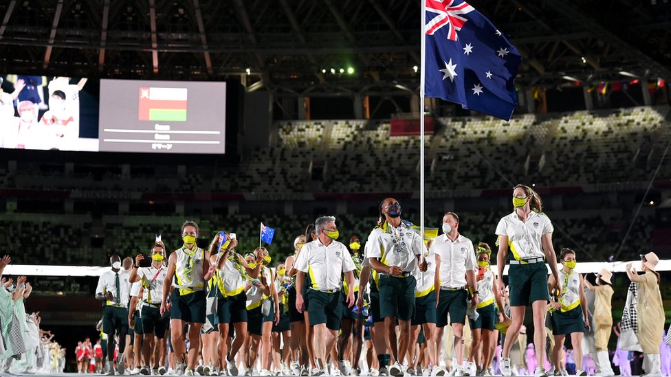 Flag bearers Cate Campbell and Patty Mills of Team Australia lead their team out during the Opening Ceremony of the Tokyo 2020 Olympic Games at Olympic Stadium on July 23, 2021 in Tokyo, Japan.
