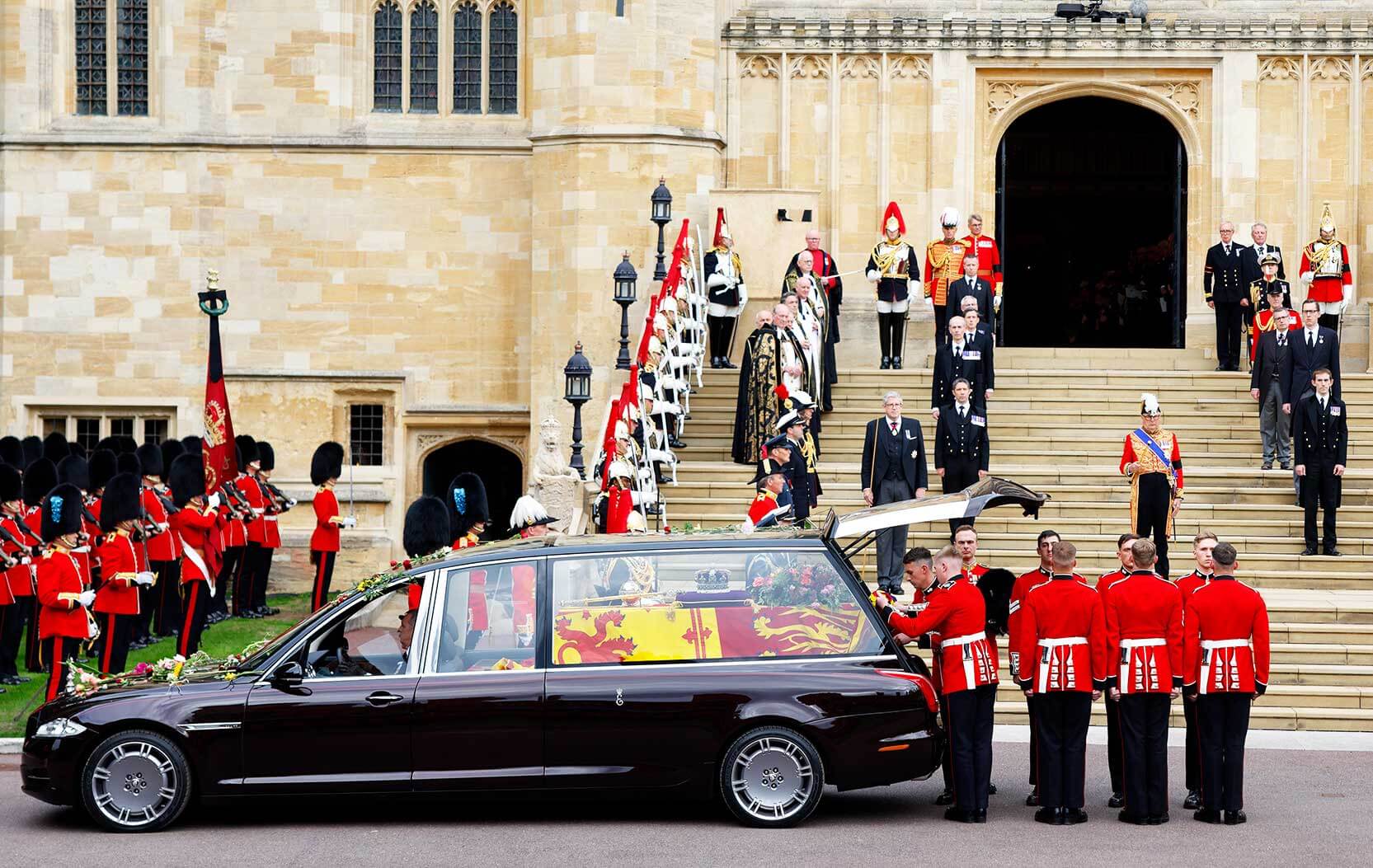 The Bearer Party remove the Queen's coffin from the hearse