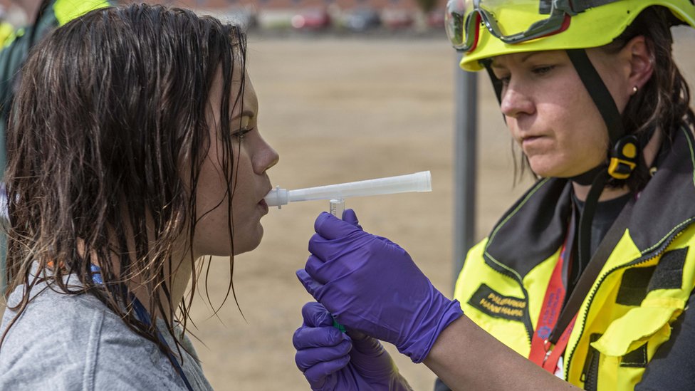 Woman being given a breath test during a Toxi-triage exercise
