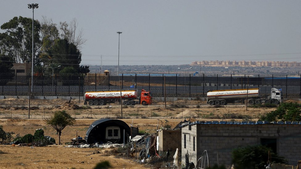 UN-flagged fuel trucks move towards the Rafah border crossing in the southern Gaza Strip, on 16 October 2023