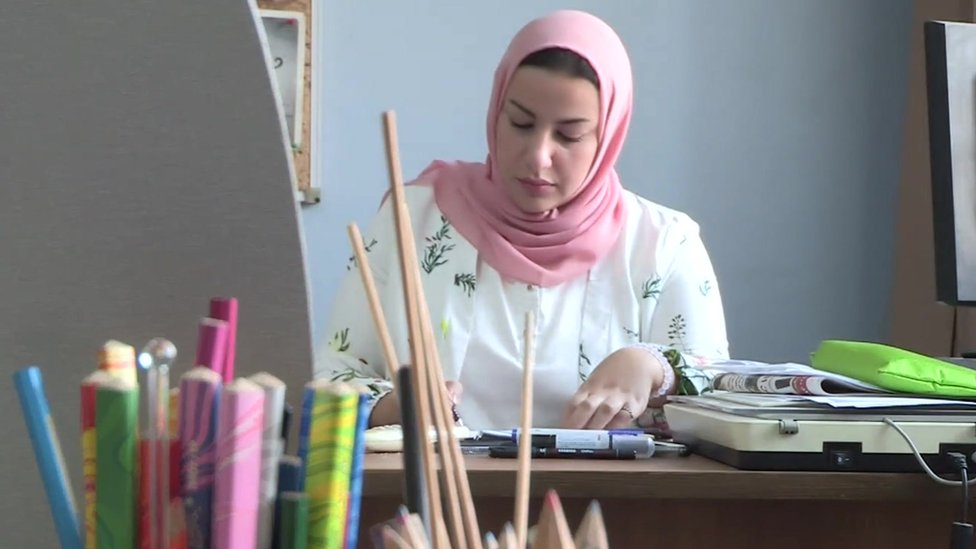 Doaa el-Adl, a cartoonist from Egypt, drawing in her office
