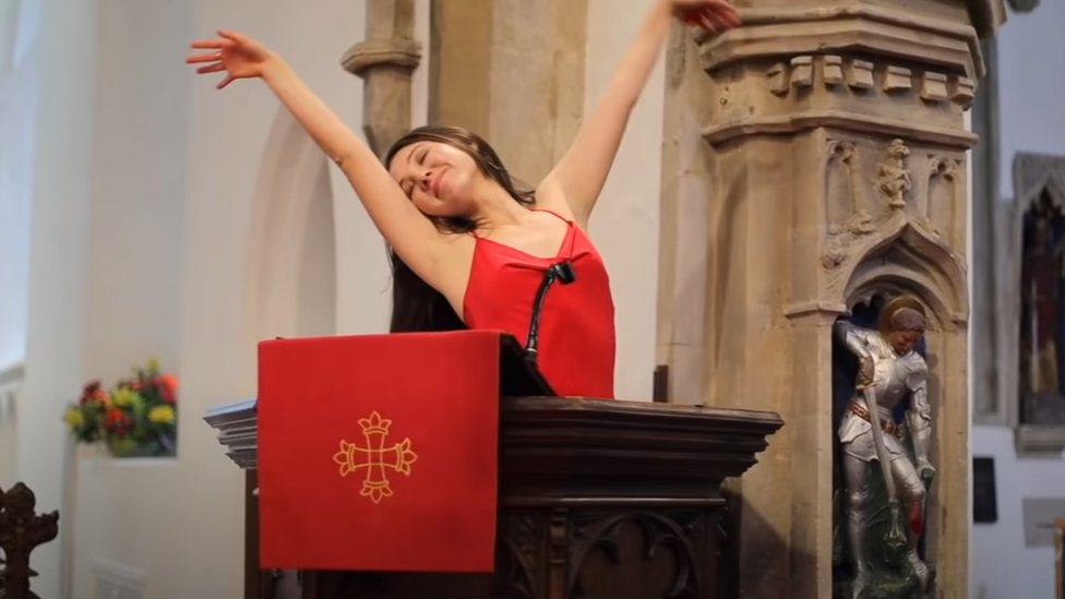 red dress sarah brand Sarah Brand: Viral pop song 'purposely sung out of tune'