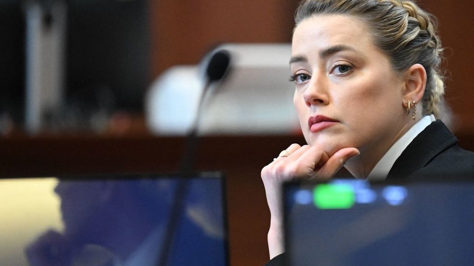 Amber heard listens to testimony in court in Virginia
