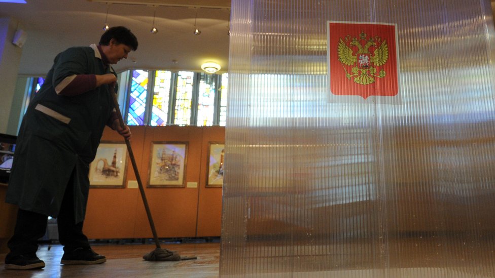 File pic of a cleaner in a Moscow polling station
