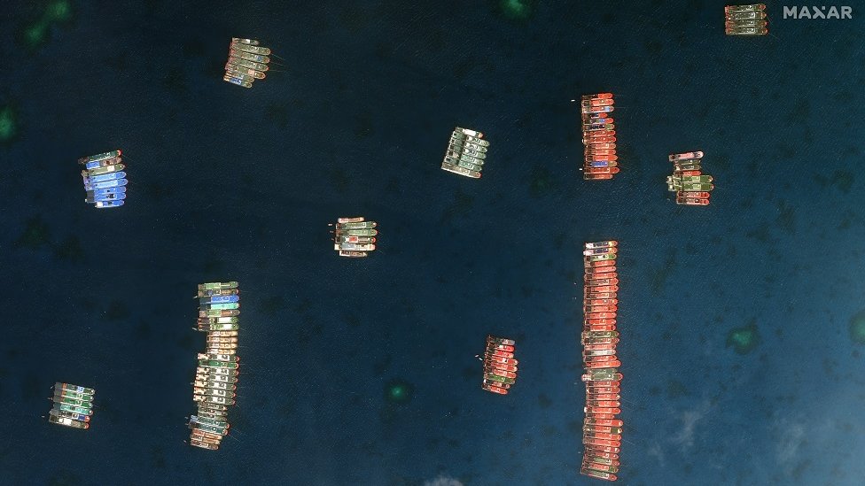A handout satellite image made available by MAXAR Technologies shows Chinese vessels anchored at the Whitsun Reef in the disputed South China Sea on 23 March 2021 (issued 25 March 2021).