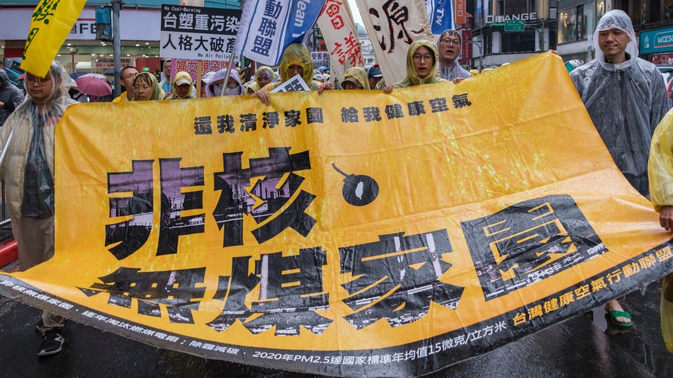Protesters holding a big yellow banner saying ''No Nuclear Plant and no Coal Plant'' during a protest in Taipei City, on December 29, 2019 calling for better air quality and demanding the closure of one of the oldest coal power plant in Taiwan responsible for the pollution of the southern part of the country (Photo by Jose Lopes Amaral/NurPhoto via Getty Images)
