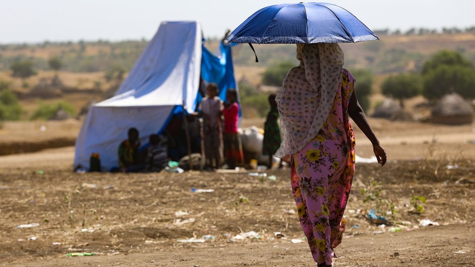 An Ethiopian woman, who fled her home due to ongoing fighting, is pictured at a refugee camp in the Hamdait border area of Sudan's eastern Kassala state on November 12, 2020.