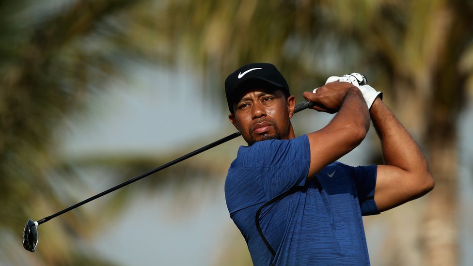 Tiger Woods threatens aggressive legal action over nude photos