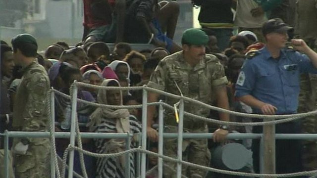 Naval force officers on migrant ship from Libya