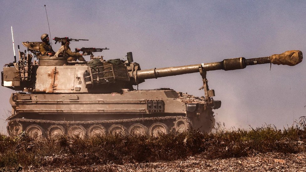 An Israeli army artillery howitzer moves at a position near the border with the Gaza Strip in southern Israel on 3 November 2023 amid the ongoing battles between Israel and the Palestinian group Hamas in the Gaza Strip.