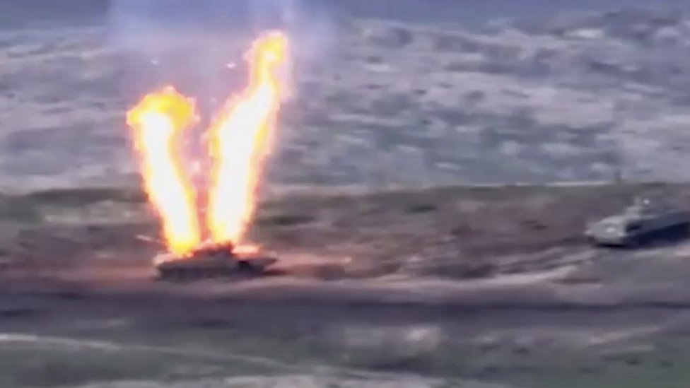 A still from handout video by Armenia's defence ministry shows what Armenia says is a destroyed Azerbaijani tank