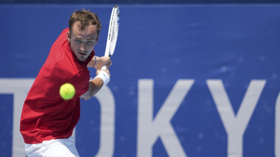 Daniil Medvedev of the Russian Olympic Committee in action against Fabio Fognini of Italy during their Tokyo 2020 Olympic Games men's singles third round tennis match