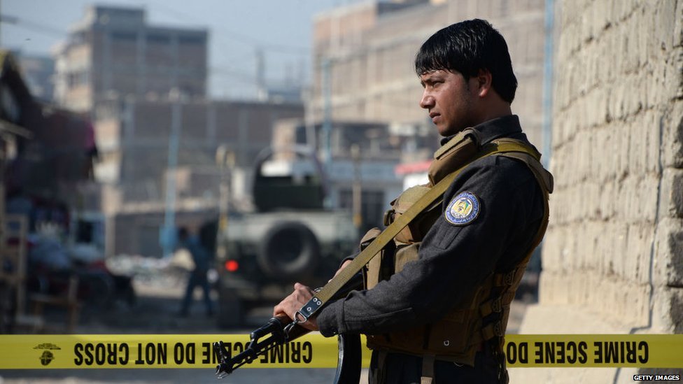 A member of Afghan security forces stands guard