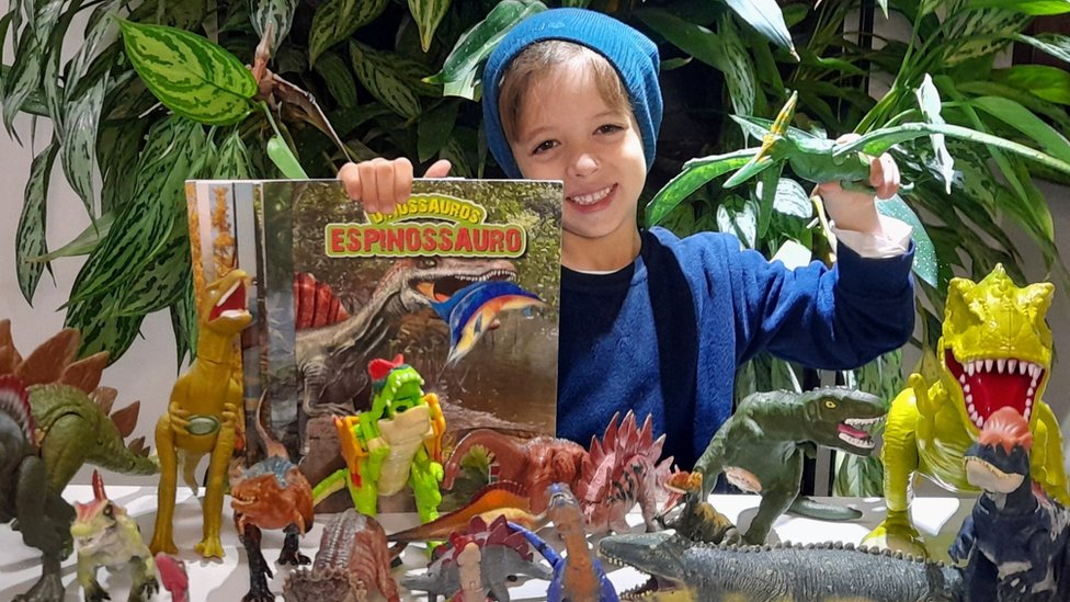 Theo Costa Ribeiro playing with dinosaurs