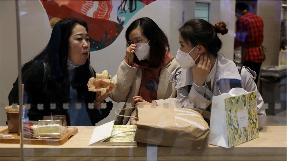 People dine inside a restaurant at a newly opened shopping mall in Beijing, China April 16, 2021.