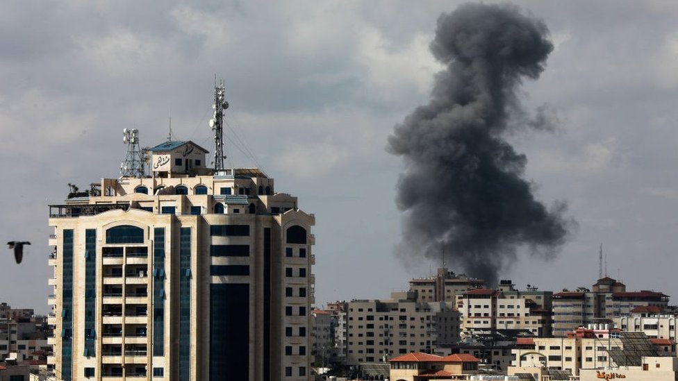 Smoke billows following an Israeli air strike on targets in Gaza City