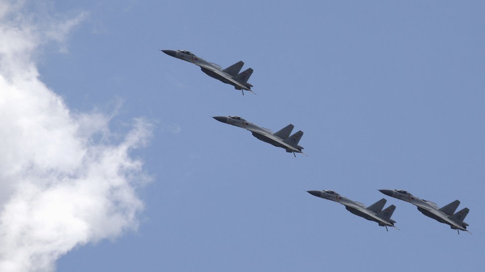 J-11B fighter jets of the Chinese Air Force fly in formation during a training session for the upcoming parade marking the 70th anniversary of the end of World War Two, on the outskirts of Beijing on 2 July 2015.