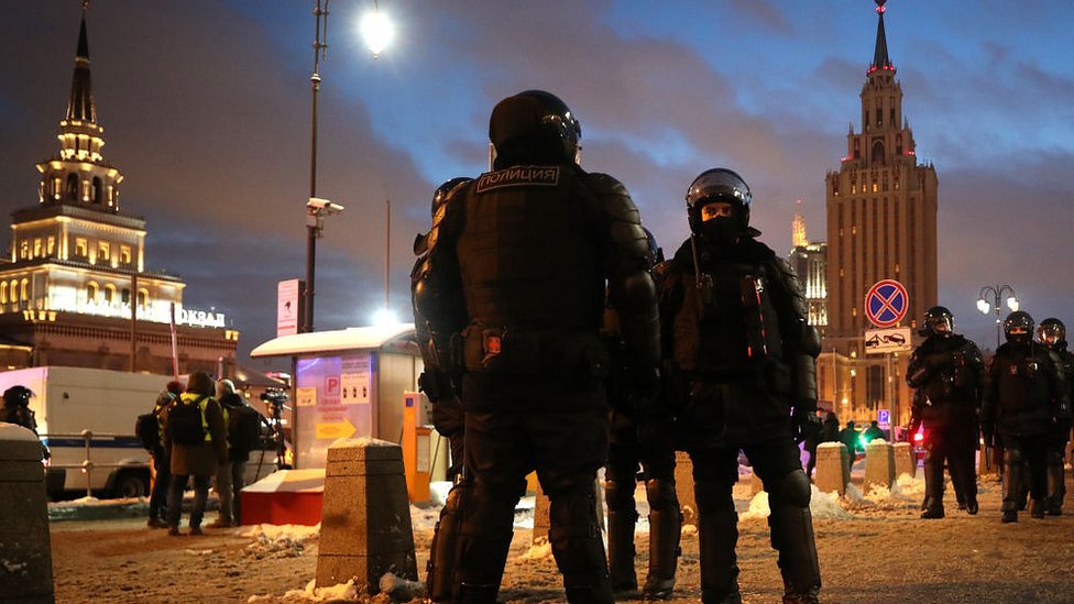 Riot police stand guard during an unauthorised protest in support of Russian opposition activist Alexei Navalny in central Moscow