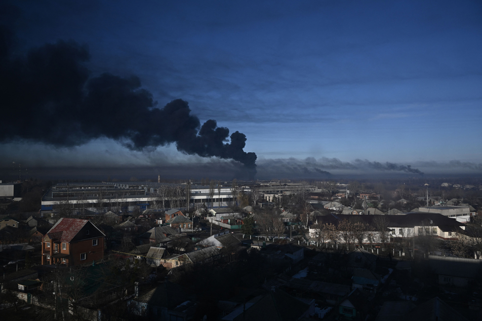 Black smoke rises from a military airport in Chuguyev near Kharkiv on February 24, 2022