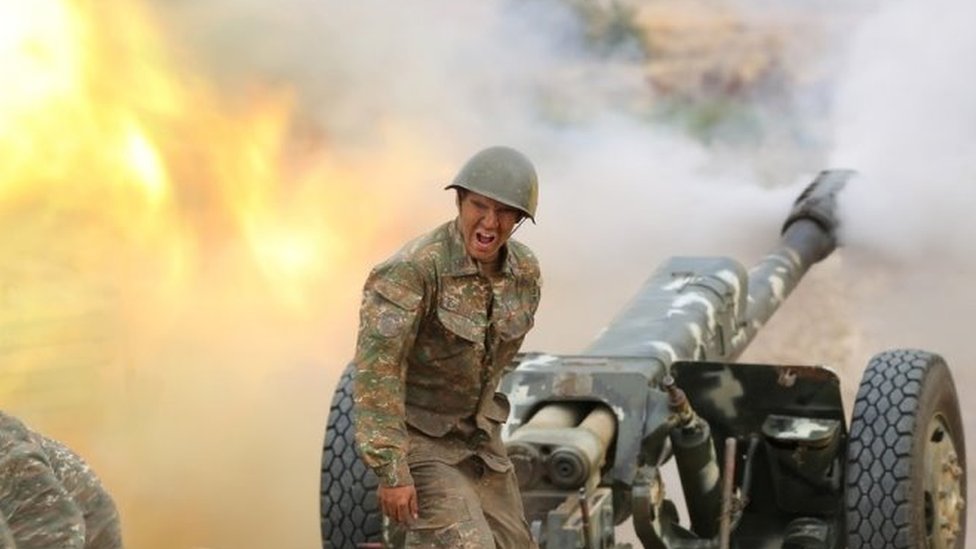 An ethnic Armenian soldier fires an artillery piece in Nagorno-Karabakh. Photo: 29 September 2020