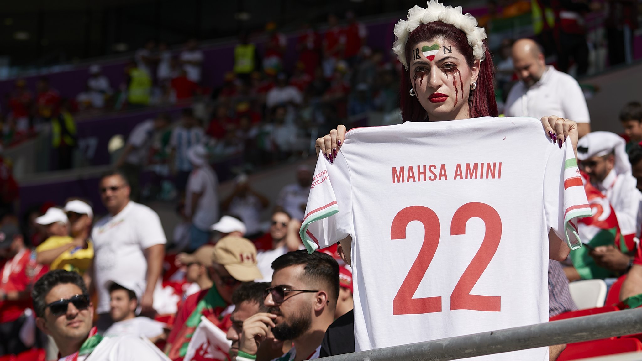 Barred from men's soccer games at home, Iranian women flock to World Cup in  Qatar