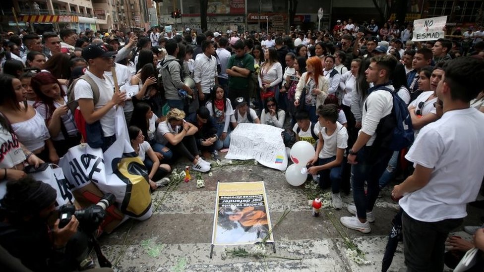 People gather in the street where Dilan Cruz was injured in Bogota, Colombia November 24, 2019