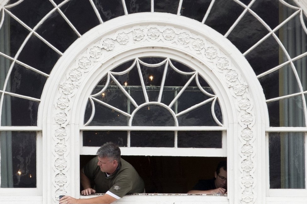 a worker fixes windows