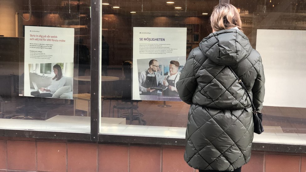 Bulgarian job seeker in front of employment centre window