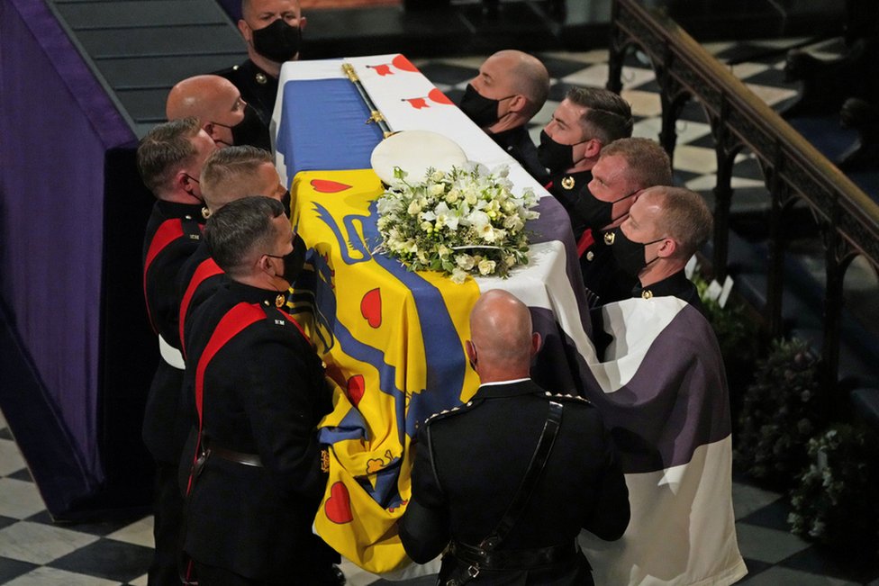 The coffin is carried into St George's Chapel during the funeral of Britain"s Prince Philip, who died at the age of 99, at Windsor Castle, Britain, April 17, 2021.