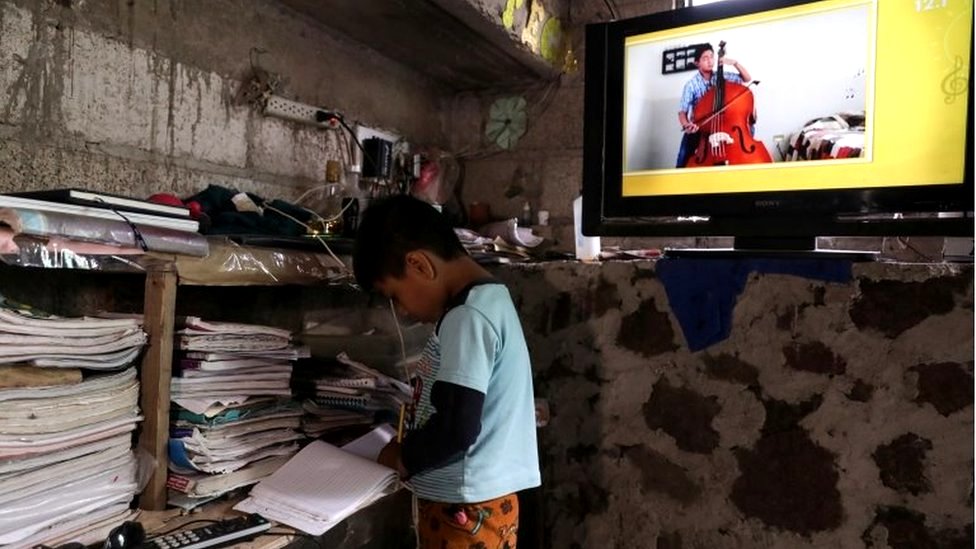 Oscar Hernandez, 5, follows a televised class at home as millions of students returned to classes virtually after schools were ordered into lockdown in March, due to the coronavirus disease (COVID-19) outbreak, in Chilcuautla, Hildalgo state, Mexico August 24, 2020.