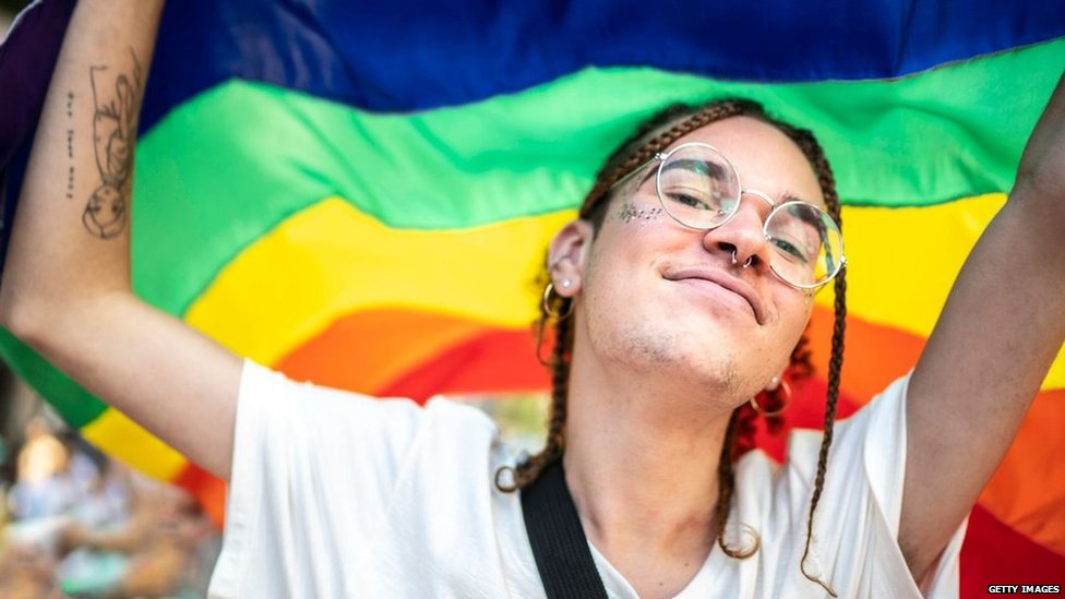 Gen-z youngster with the pride flag