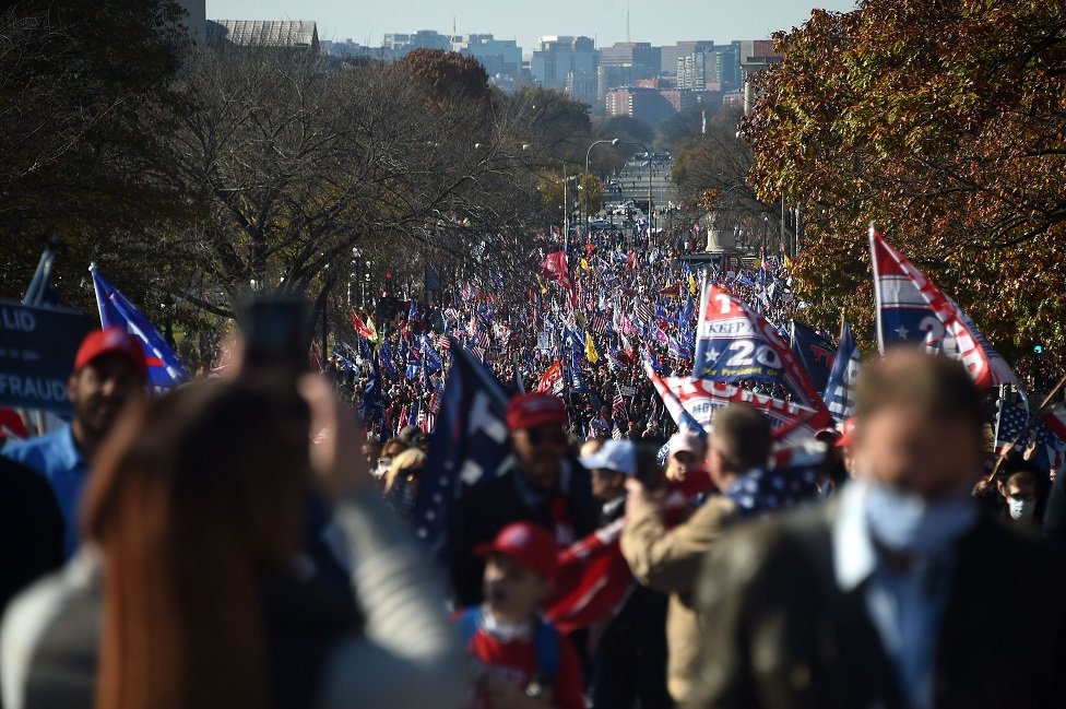 Supporters of US President Donald Trump march during a rally in Washington, DC, on 14 November 2020