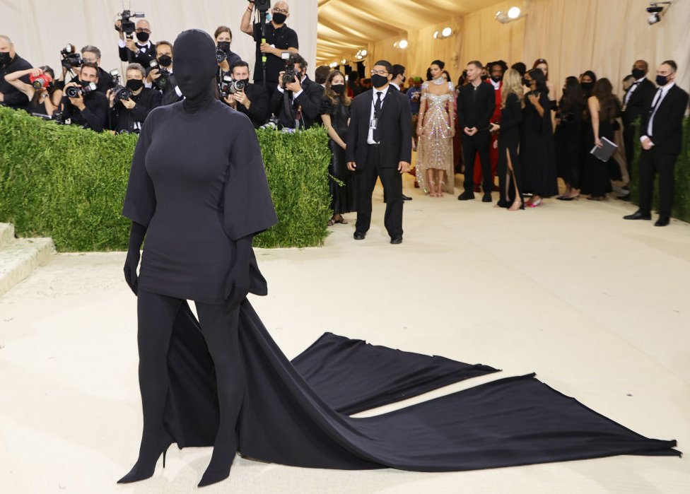 Kim Kardashian dressed in an all-enveloping black outfit that also covers her face