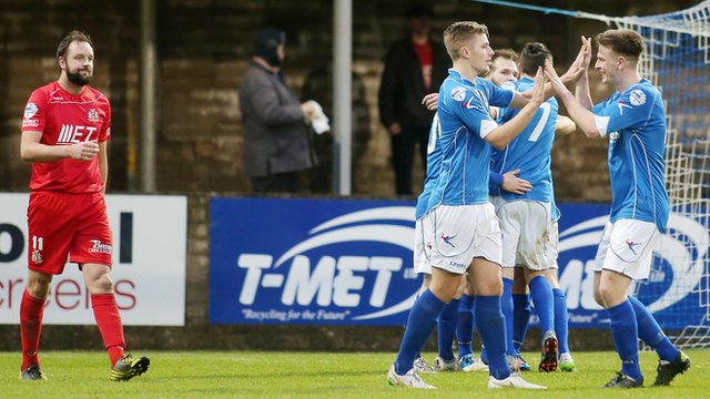 Dungannon Swifts players celebrate victory over Portadown in the Irish Premiership