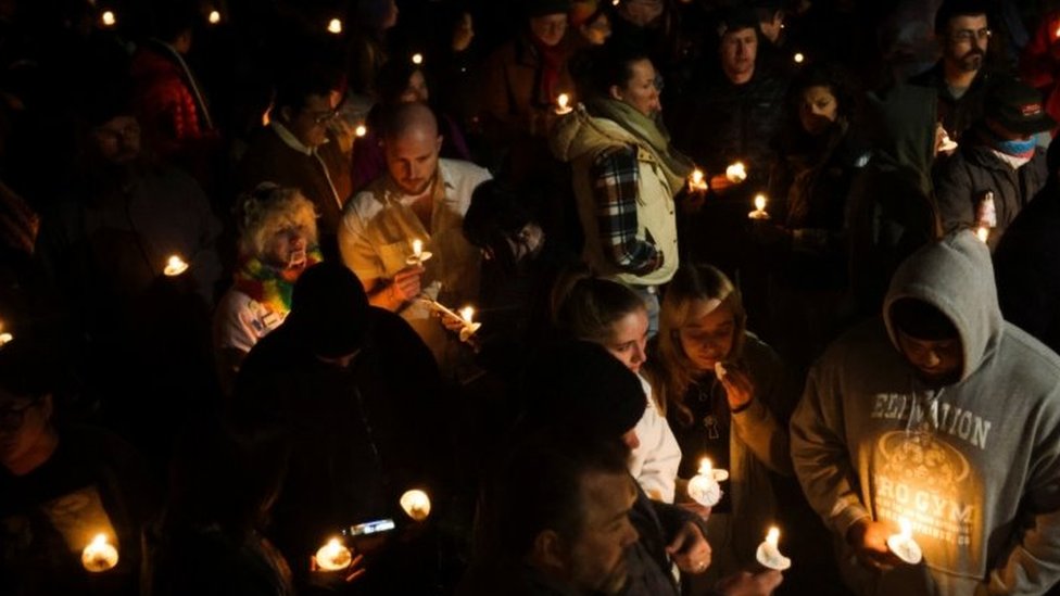 Mourners with lit candles hold a vigil in Colorado Springs. Photo: 20 November 2022