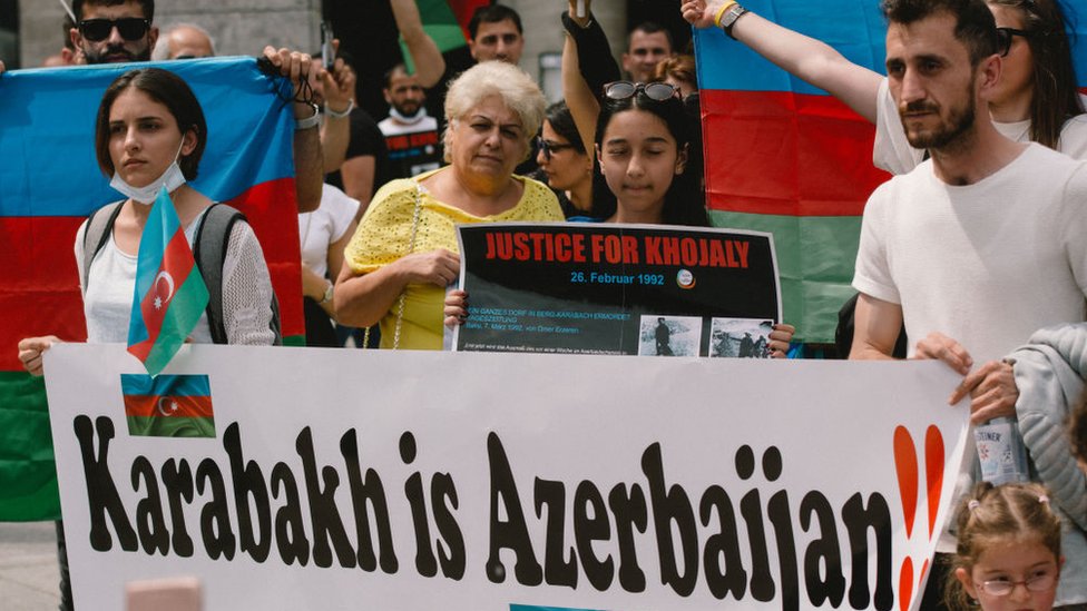 Protesters in Germany holding a sign saying Karabakh is Azerbaijan