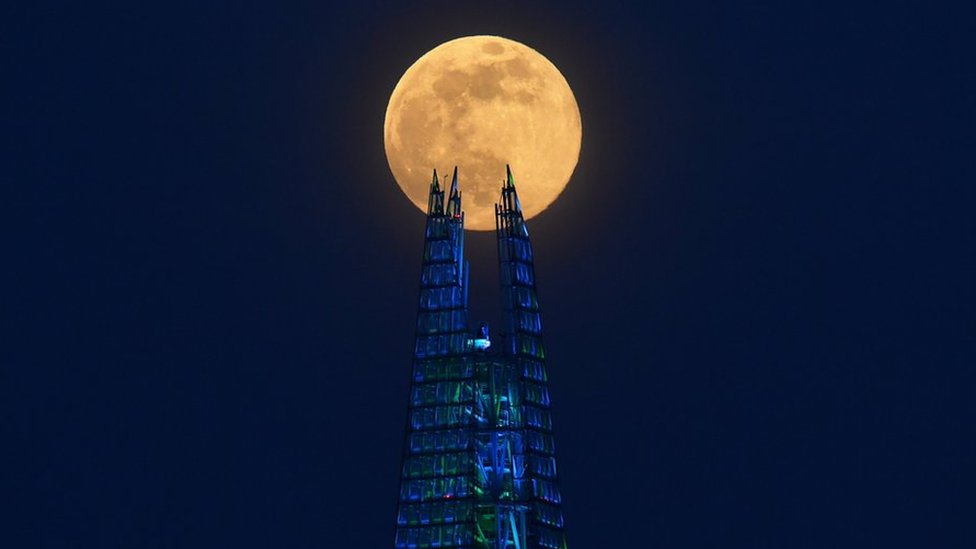 The Pink Supermoon rises over the Shard skyscraper in London