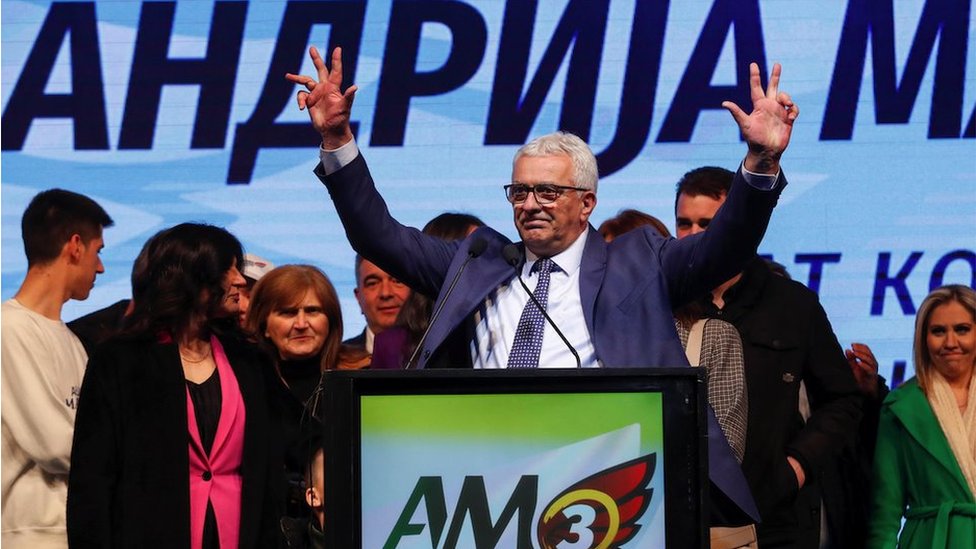 Andrija Mandic, Djukanovic's main opponent and the head of the pro-Serbian and pro-Russian Democratic Front, flashes a three finger Serbian salute during his last pre-election rally in Podgorica, Montenegro, March 17, 2023. REUTERS/Stevo Vasiljevic