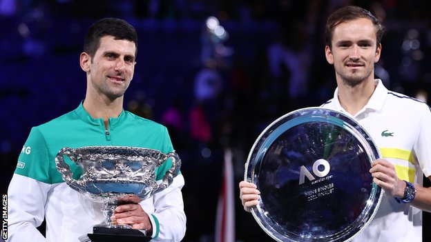 Novak Djokovic and Daniil Medvedev with their 2021 Australian Open trophies
