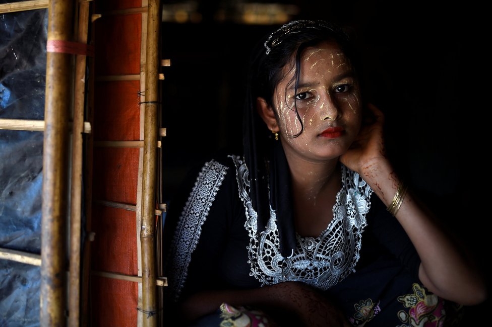 Rohingya refugee Juhara Begum, aged 13, poses for a photograph as she wears thanaka paste at Jamtoli camp in Cox's Bazaar, Bangladesh