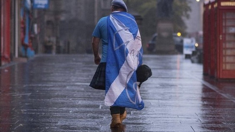 Scottish independence supporter walking along Edinburgh's Royal Mile after 2014 vote
