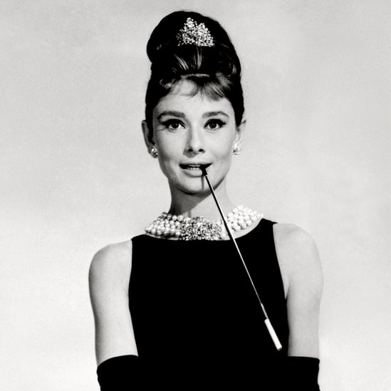 audrey hepburn black dress and pearls