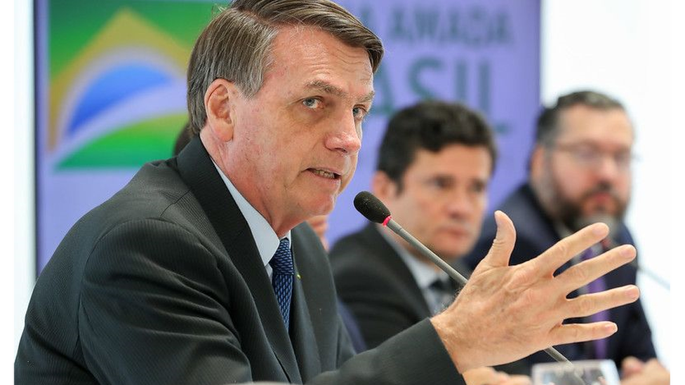 Bolsonaro, com Moro ao fundo, na reunião de 22 de abril