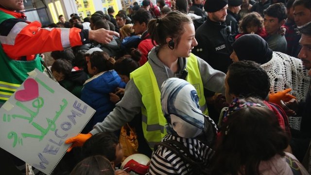 Migrants arriving from Hungary are greeted by crowds at Munich station