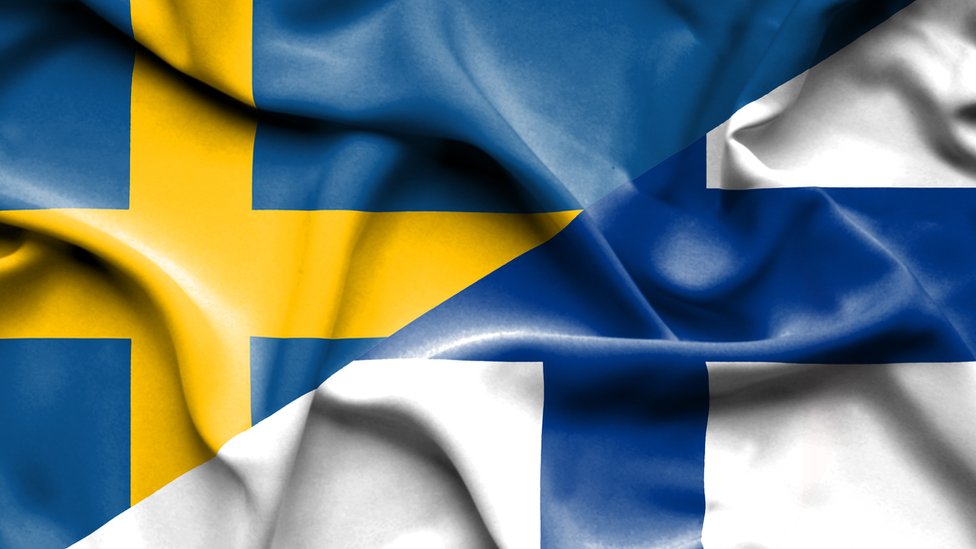 Banderas de Suecia y Finlandia.